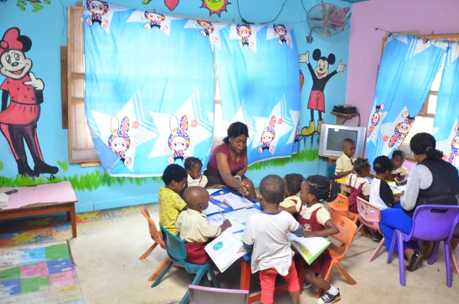 Pupils gathered around a table for a group activity