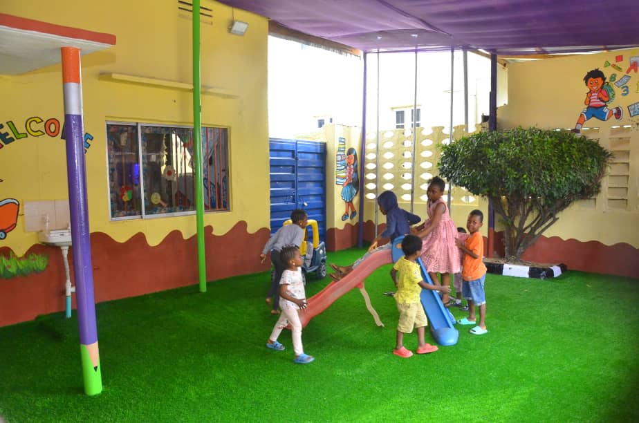Children playing on the outdoor slide